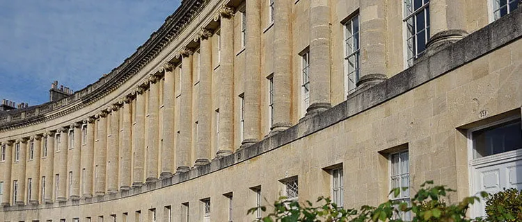 Landscape wide angle shot of Royal Crescent in Bath city centre showing terraced building.