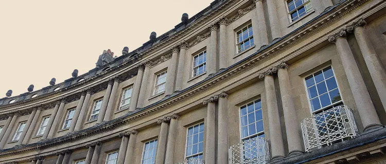 Image of buildings in Bath City Centre showing windows balconies and sky.