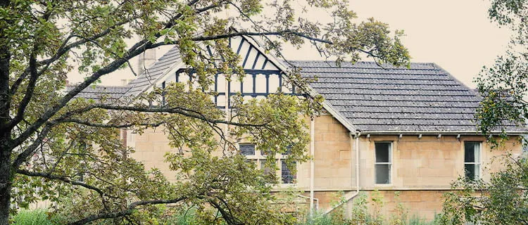 Landscape image of a residential home in Bath city showing the roof and the sky