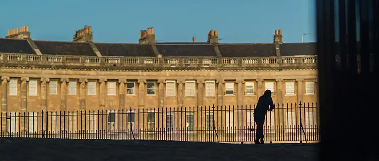 Person in front of buildings